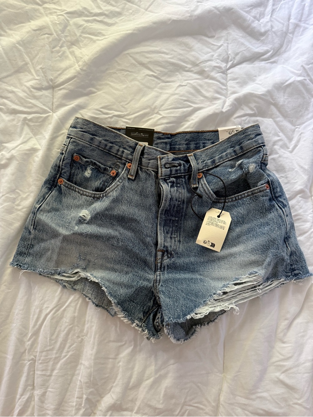 NWT Levi's Distressed Light Blue Denim Cutoff Shorts 26